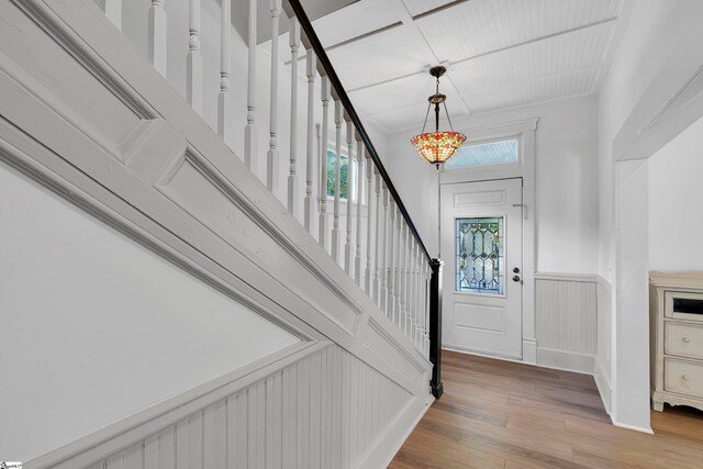 entryway with hardwood / wood-style flooring and plenty of natural light