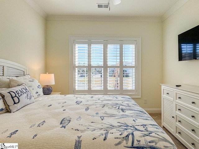 bedroom with ornamental molding