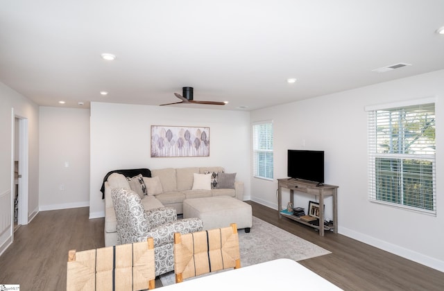 living room with hardwood / wood-style flooring, plenty of natural light, and ceiling fan