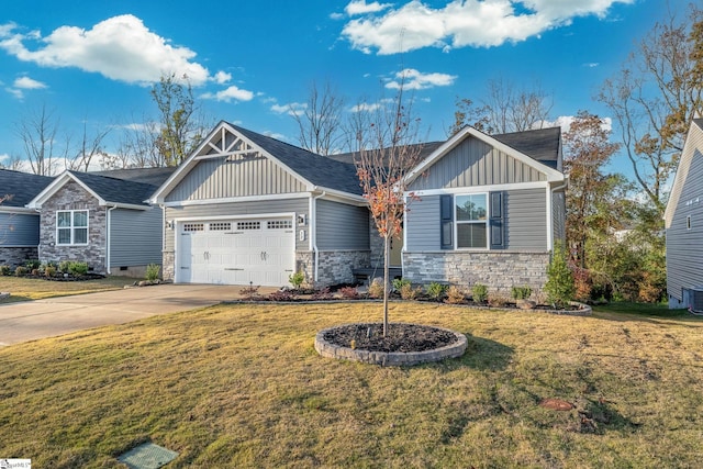 craftsman-style home featuring central AC, a front lawn, and a garage