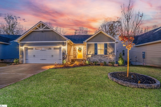 craftsman-style house featuring a yard and a garage