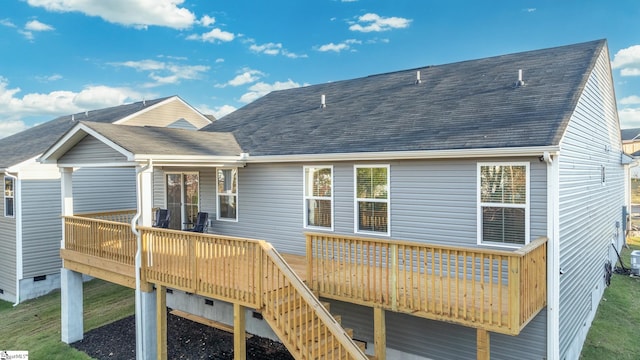 back of house with a wooden deck