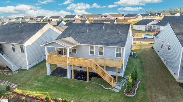 rear view of house with a yard, a deck, and central air condition unit