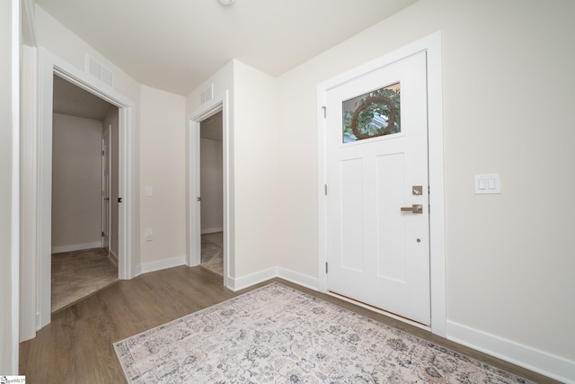 entryway with light hardwood / wood-style flooring