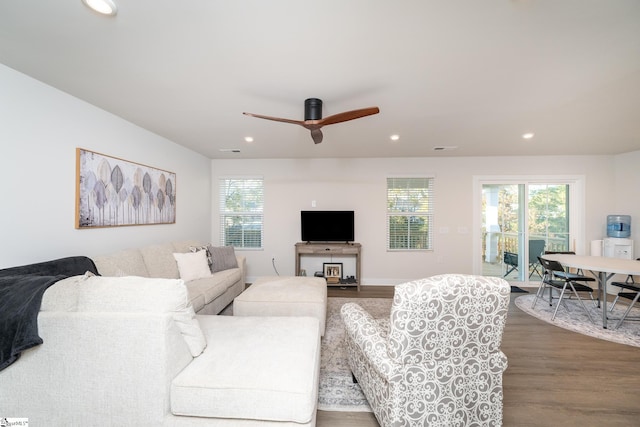 living room with ceiling fan and hardwood / wood-style floors