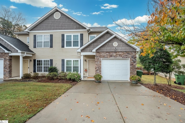 view of front of property featuring a front yard and a garage