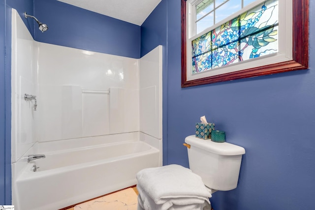 bathroom with shower / bathtub combination and toilet