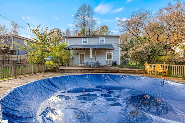 view of swimming pool with a deck