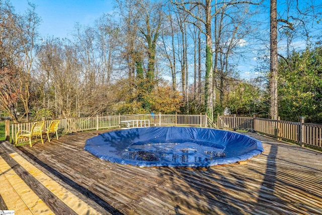 view of pool featuring a wooden deck