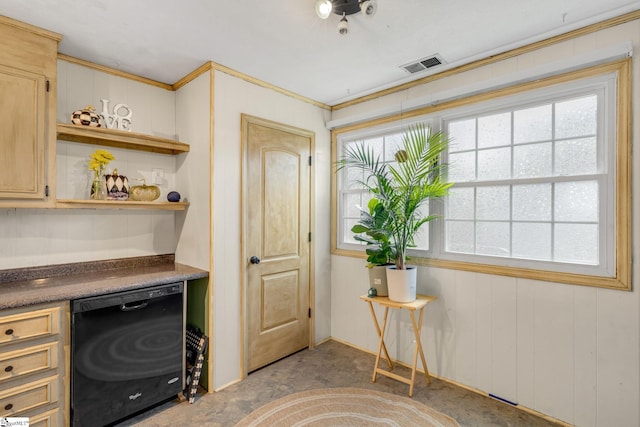 office space with wooden walls, a healthy amount of sunlight, and ornamental molding