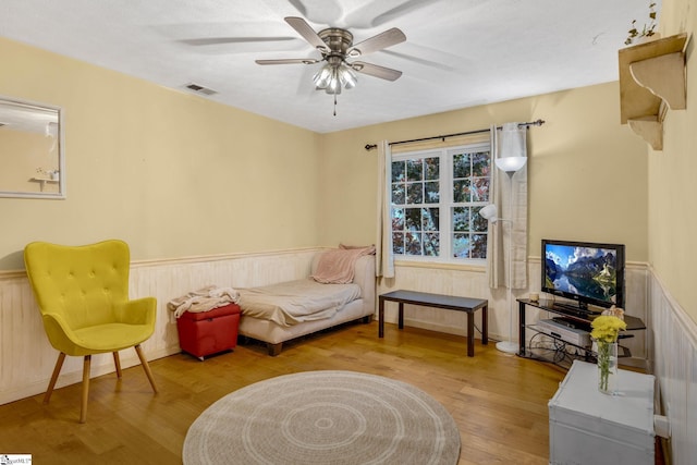 sitting room featuring light wood-type flooring and ceiling fan