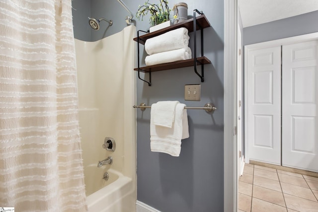 bathroom with tile patterned floors and shower / bath combo