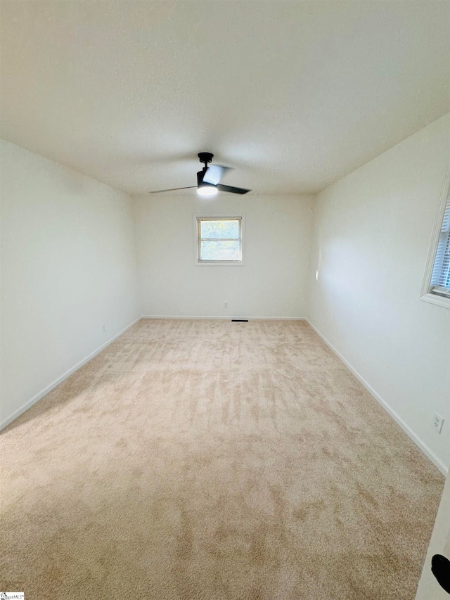 empty room featuring light carpet