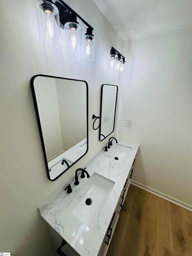 bathroom with vanity and hardwood / wood-style flooring