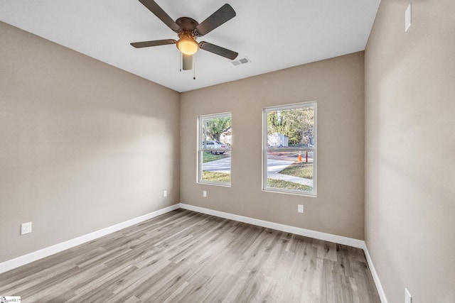 unfurnished room with light hardwood / wood-style flooring and ceiling fan