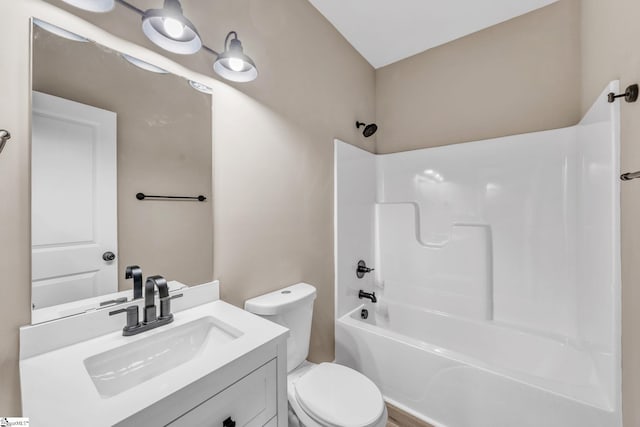 full bathroom with vanity, toilet, and washtub / shower combination