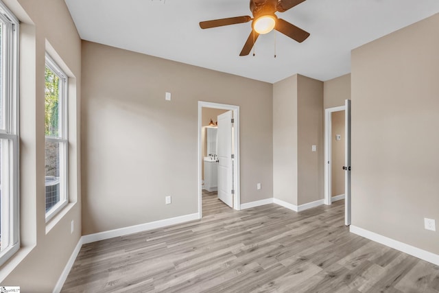 spare room with ceiling fan and light hardwood / wood-style flooring