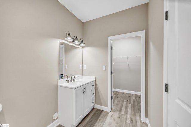 bathroom with vanity and wood-type flooring