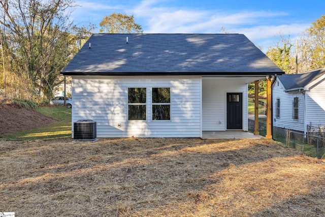 rear view of property featuring cooling unit and a patio area