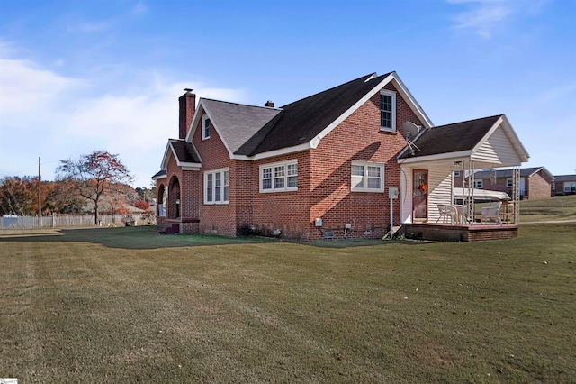 view of side of home featuring a lawn