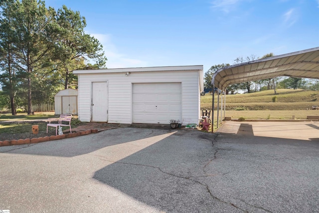 garage featuring a carport