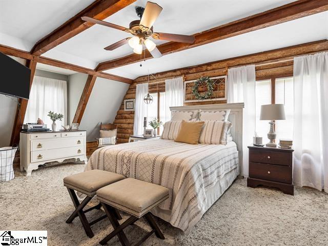 bedroom with light colored carpet, multiple windows, and ceiling fan