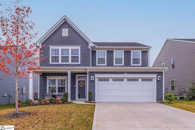 view of front facade featuring a garage and a front yard