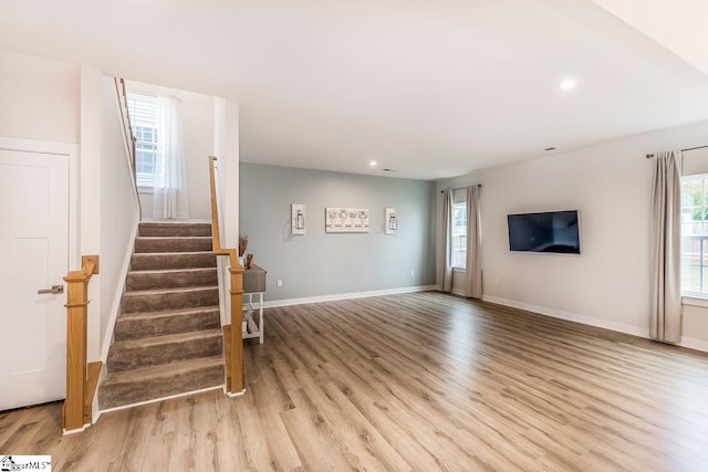 living room with light hardwood / wood-style flooring