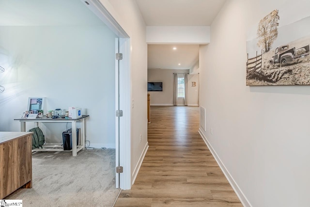 hallway featuring light hardwood / wood-style floors