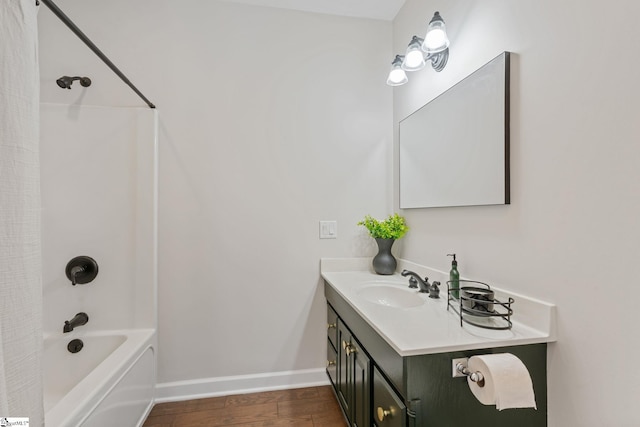 bathroom featuring vanity, shower / bathtub combination, and wood-type flooring