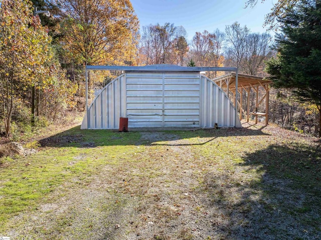 view of outdoor structure with a lawn