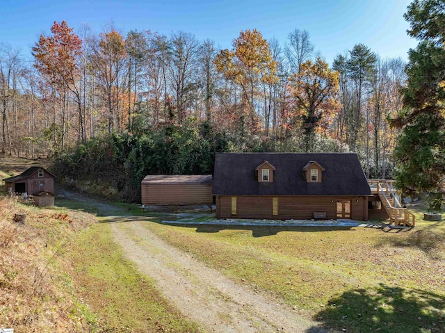 view of side of home with a lawn