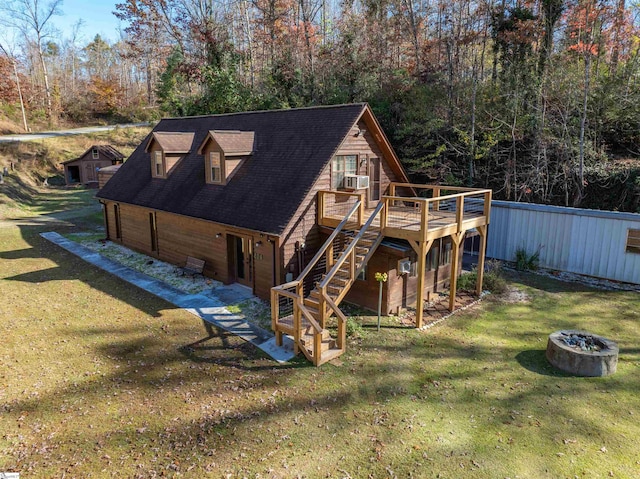 back of house featuring a yard and a deck