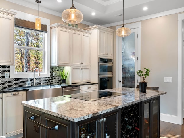 kitchen featuring decorative light fixtures, stainless steel double oven, light stone countertops, and tasteful backsplash