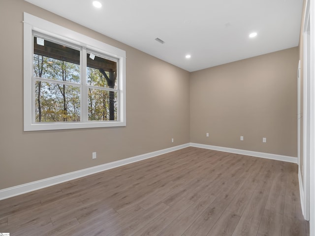 spare room featuring light hardwood / wood-style floors