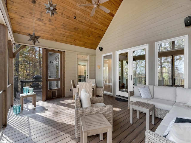 sunroom / solarium featuring ceiling fan, lofted ceiling, and wood ceiling