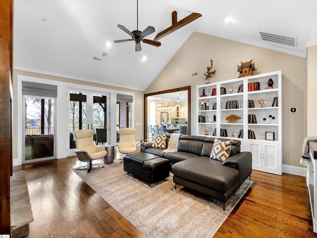 living room with dark hardwood / wood-style floors, ceiling fan, high vaulted ceiling, and french doors