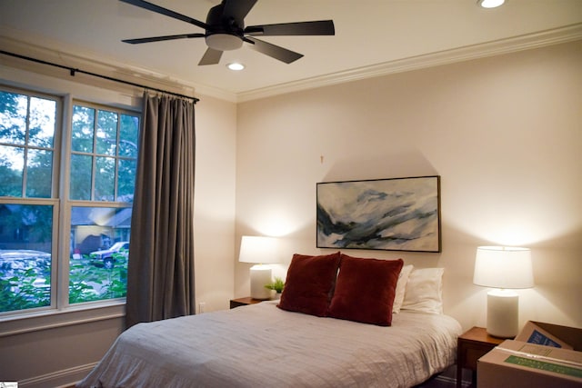 bedroom with ceiling fan and crown molding