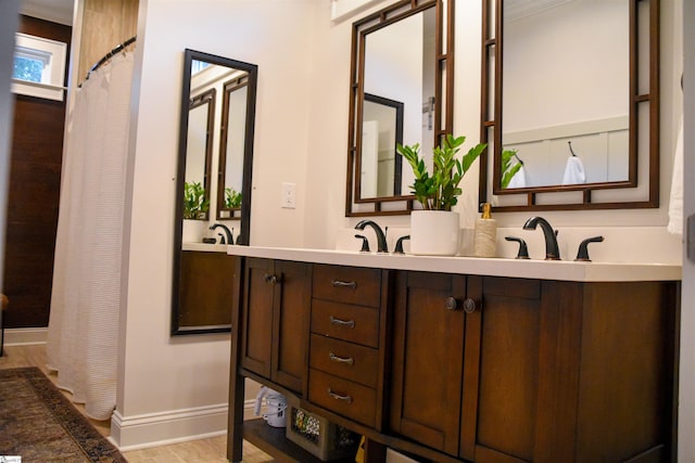 4A/B Vest St, Travelers Rest, SC 29690 - full bath featuring baseboards, double vanity, wood finished floors, and curtained shower