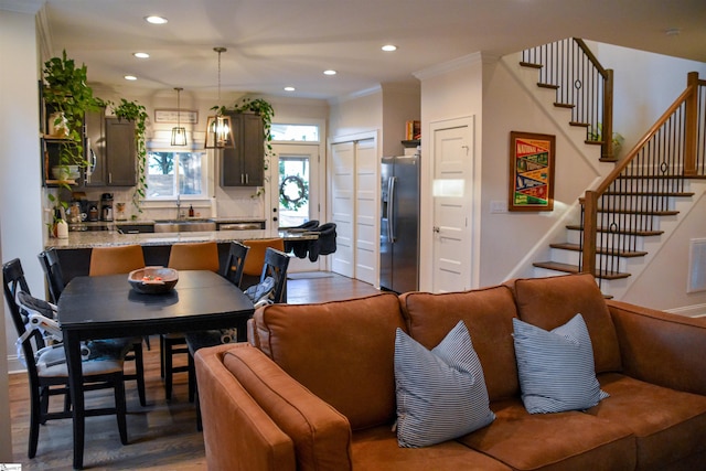 interior space featuring dark hardwood / wood-style flooring, a notable chandelier, and ornamental molding