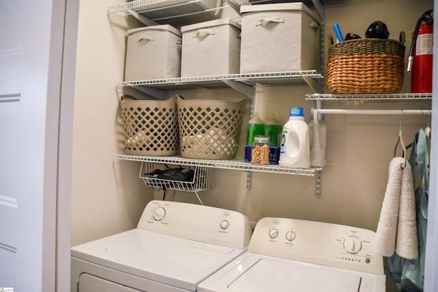 laundry area with washing machine and clothes dryer