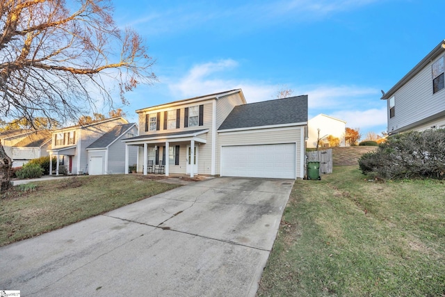 view of front of home with a front lawn, covered porch, and a garage