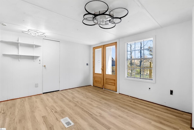 unfurnished room with light hardwood / wood-style flooring