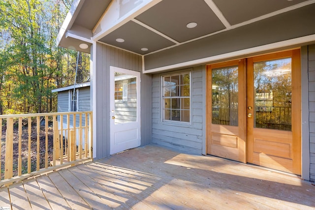 view of exterior entry with a wooden deck