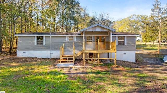 back of property featuring a wooden deck