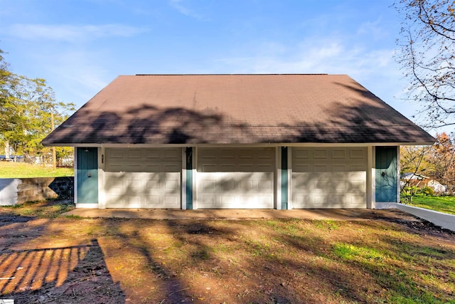 garage with a yard