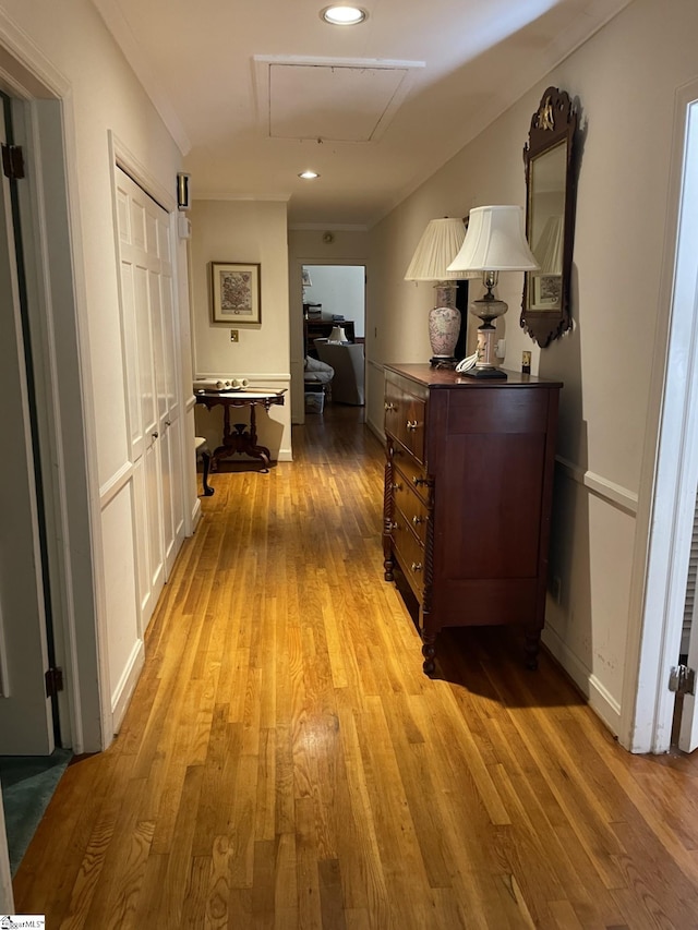 hallway with light hardwood / wood-style flooring