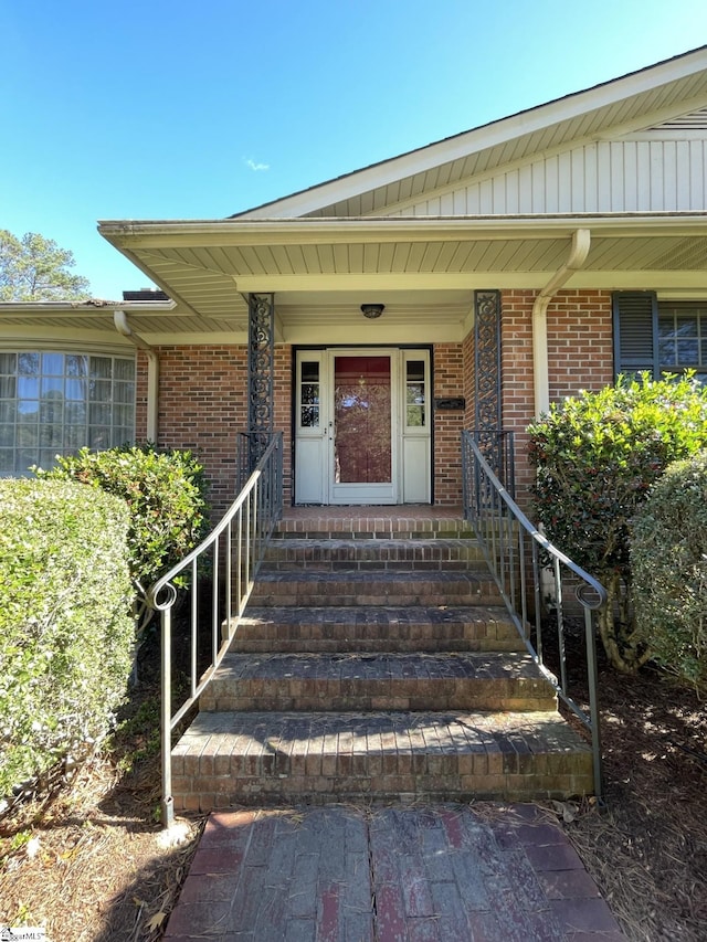 doorway to property with covered porch