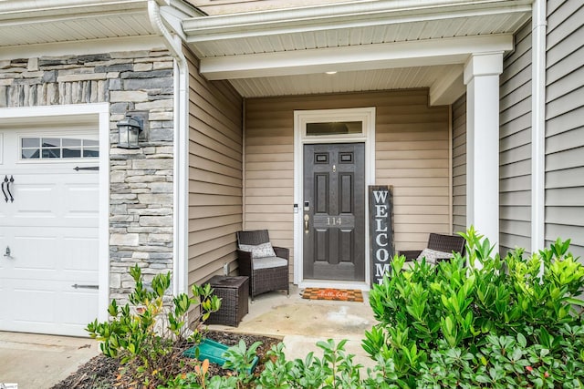 doorway to property featuring a garage