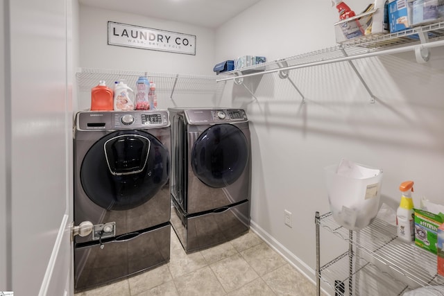 laundry room featuring independent washer and dryer and tile patterned floors